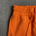 DENIM TEARS COTTON WREATH SWEATPANTS ORANGE