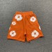 DENIM TEARS COTTON WREATH SHORTS ORANGE