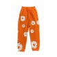 DENIM TEARS COTTON WREATH SWEATPANTS ORANGE
