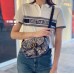 Christian Dior "Striped Logo" Polo Shirt